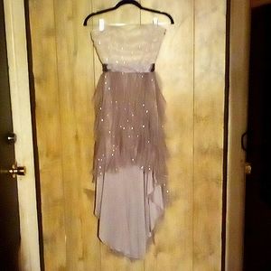 Brand is Teeze Me size 9 colors are tan/brown and gold